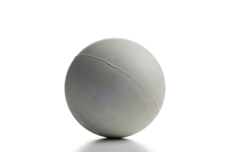 Lacrosse ball on a white background. It can be used for relief from sore muscles.