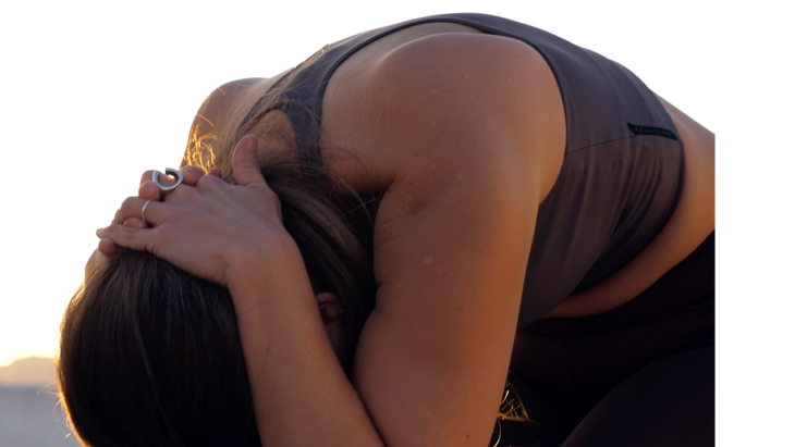 Woman practicing Cow Pose in her upper back and Chair Pose in her legs